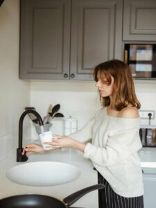 Tanya by the kitchen sink
