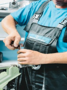 plumber working on pipes